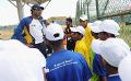             Sri Lankan Team with children from the charity ‘Room to Read’
      